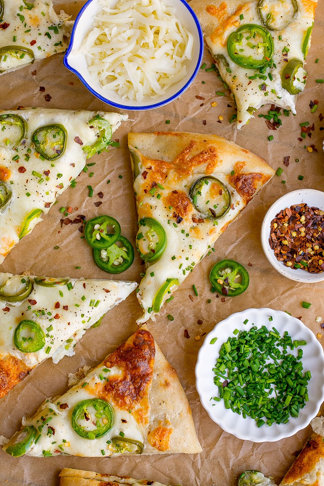 Pizza slices with jalapeños.