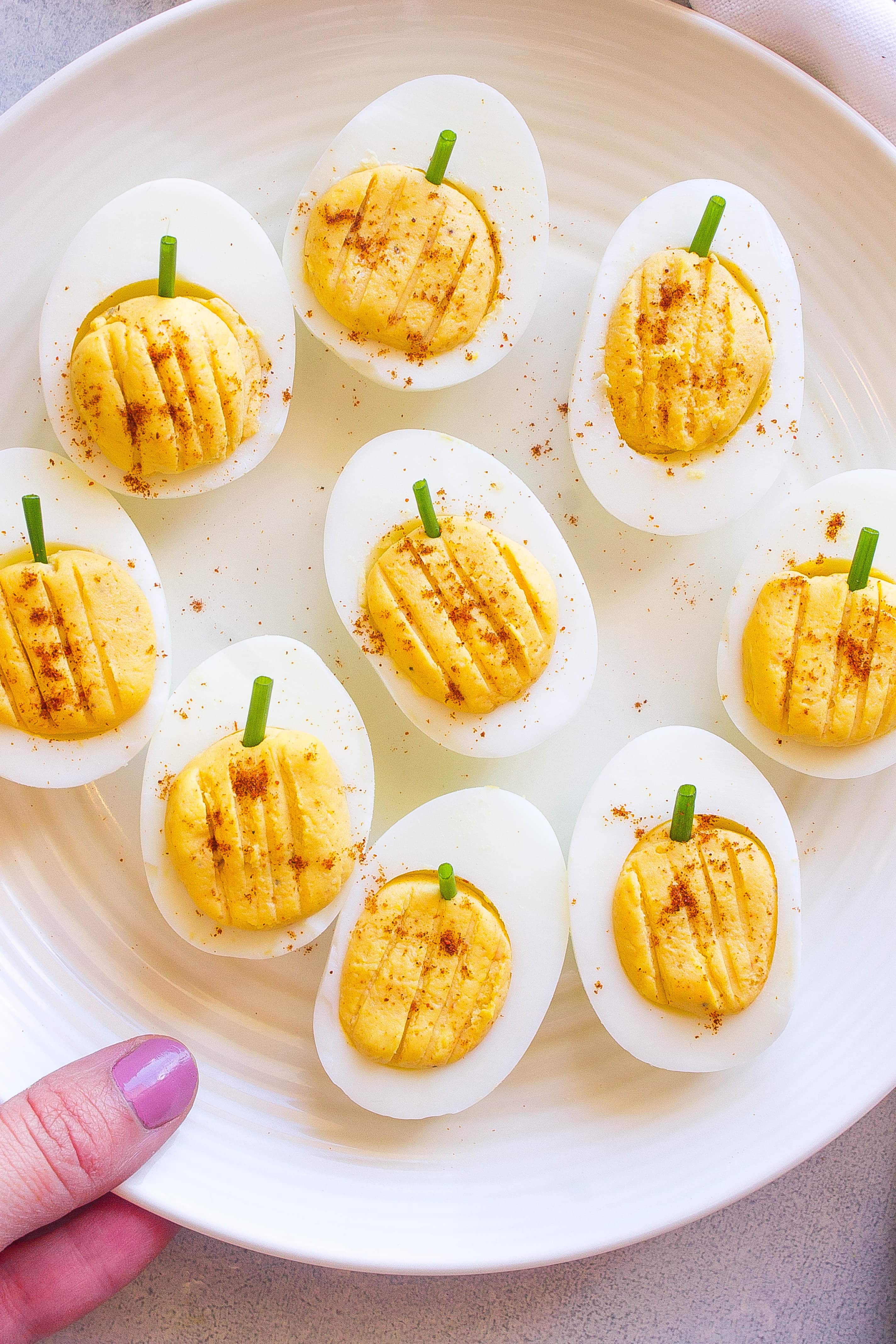 Halloween Deviled Eggs on a white dish