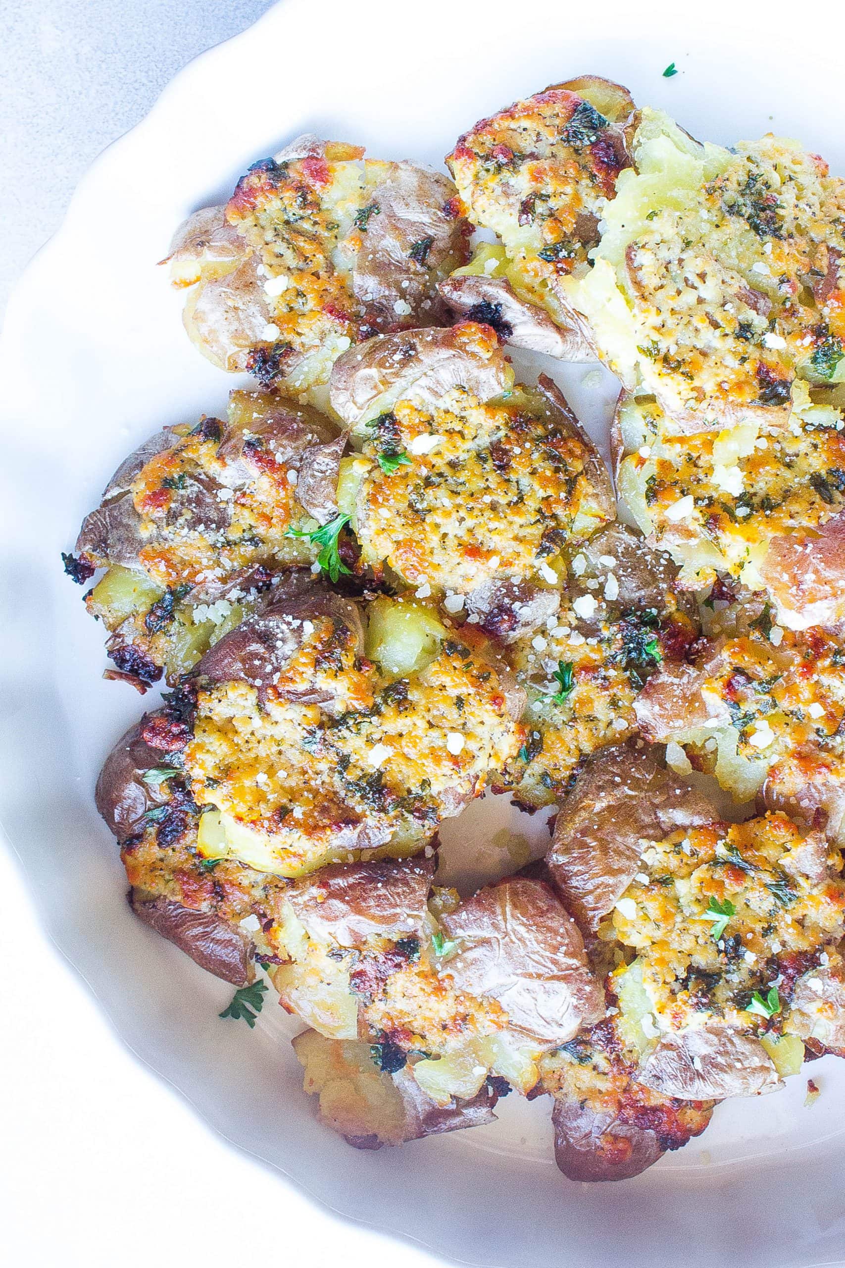 https://kathrynskitchenblog.com/wp-content/uploads/2019/12/Parm-Garlic-Potatoes-1-6-scaled.jpg