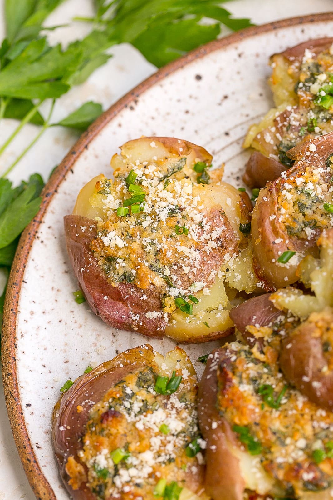 Close up of Smashed garlic parmesan potatoes.