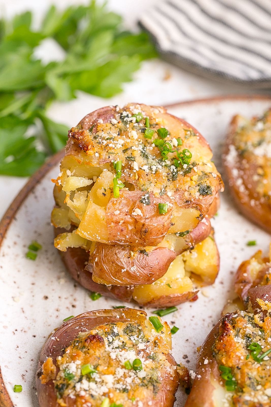 Stack of Garlic Parmesan Smashed Potatoes.