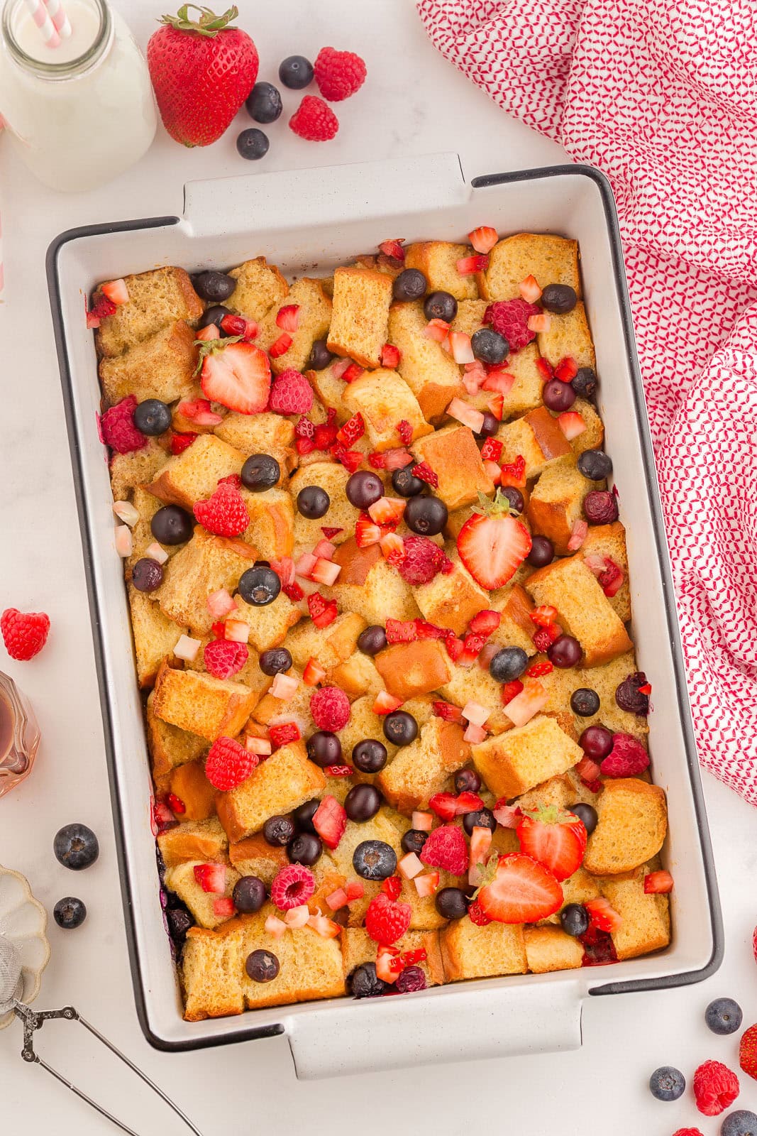 Hawaiian Roll French Toast Bake with berries on top.
