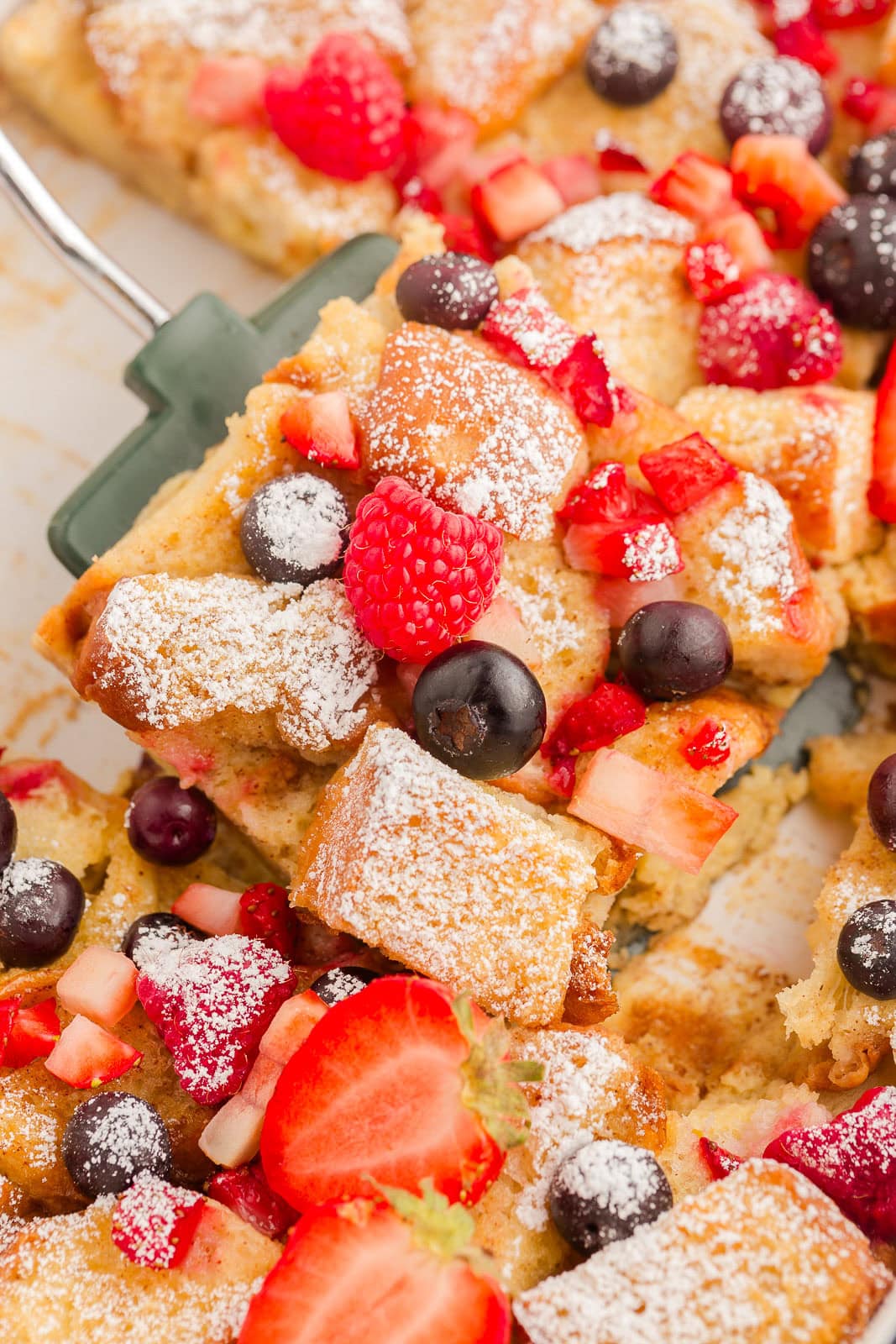 French toast with Hawaiian rolls on a spatula. 