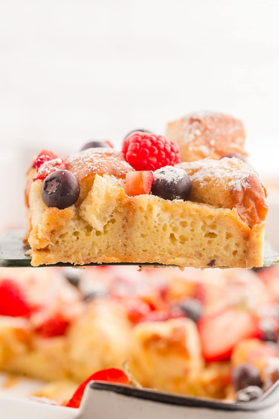 Hawaiian Roll French Toast Bake lifted with a spatula. 