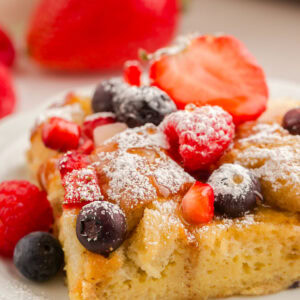 French toast with berries on top.