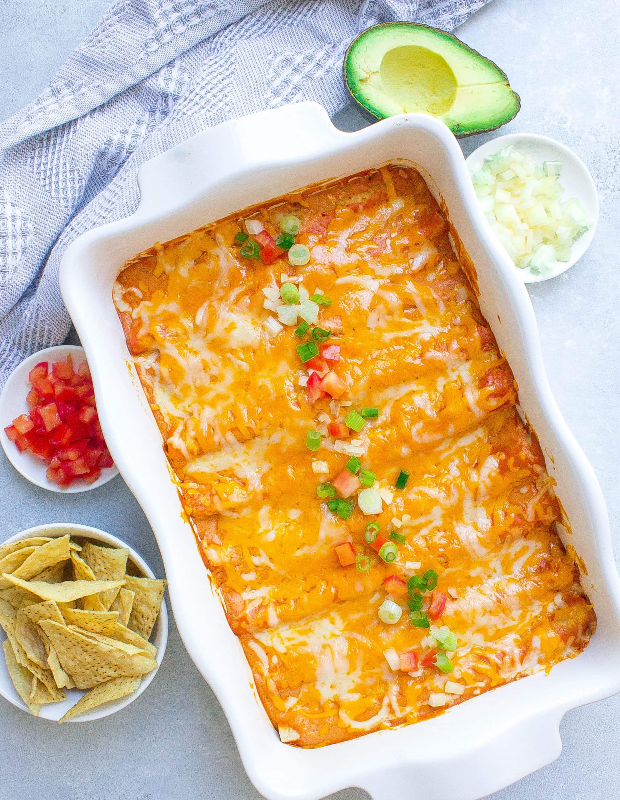 The best ever, 30 Minute Easy Cheese Enchiladas in white casserole dish.