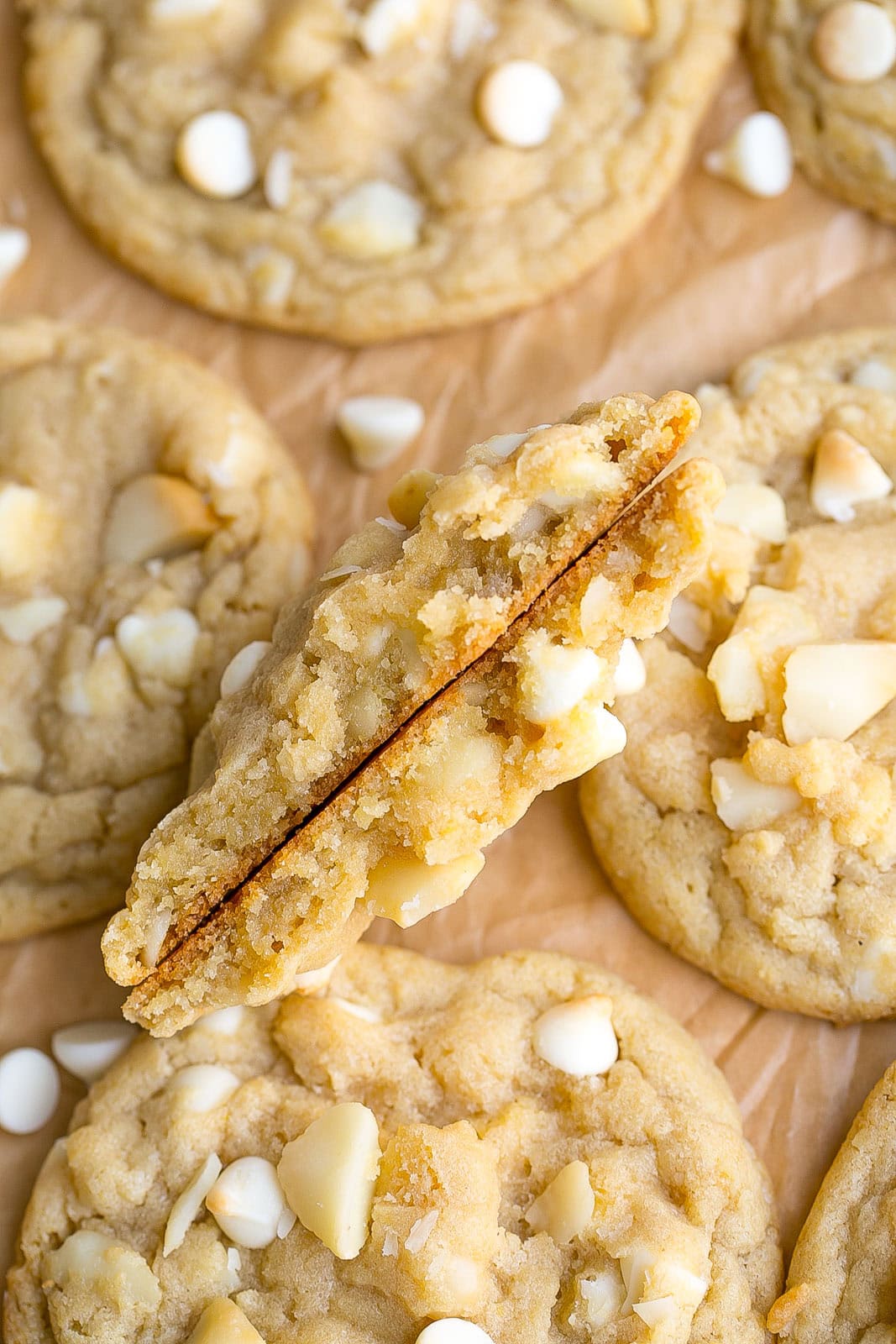 White Chocolate and Macadamia Nut Cookie cut in half.