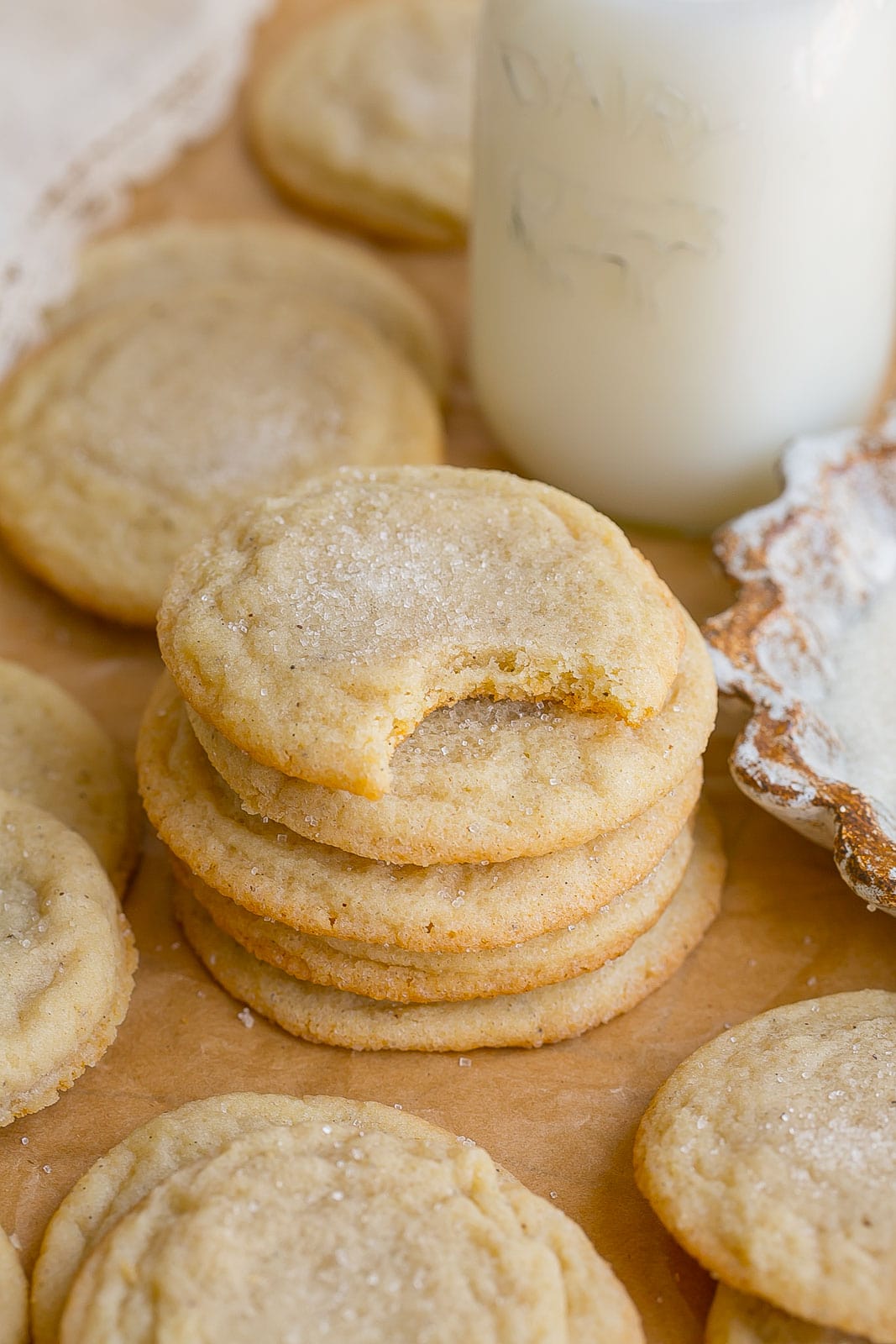 Stack of Vanilla Bean Cookies with bite mark on top.