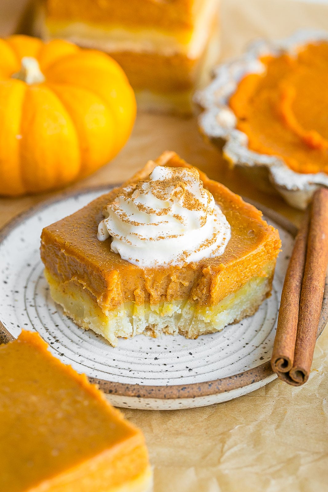 Pumpkin Pie Bars with Shortbread Crust with a bite mark.