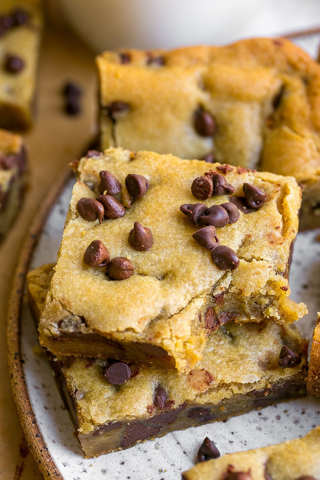 Cookie bars with chocolate chips and a bite mark.