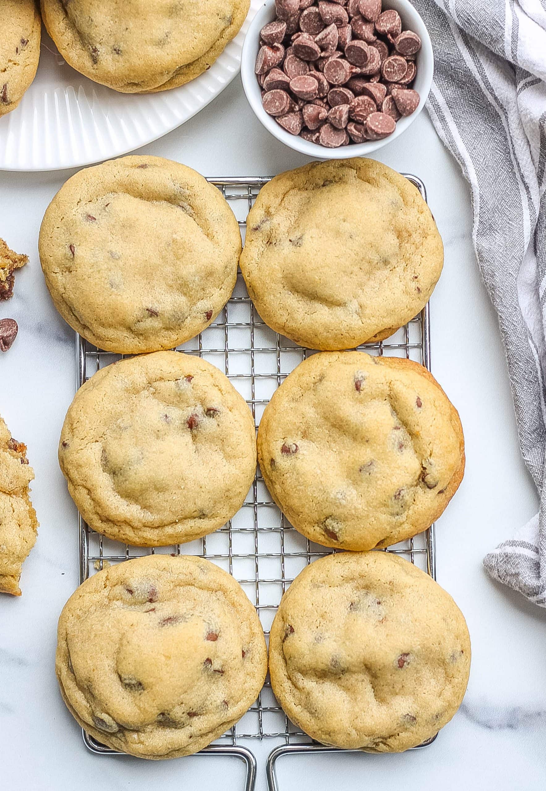 chewy and thick chocolate chip cookies on a cooling rack