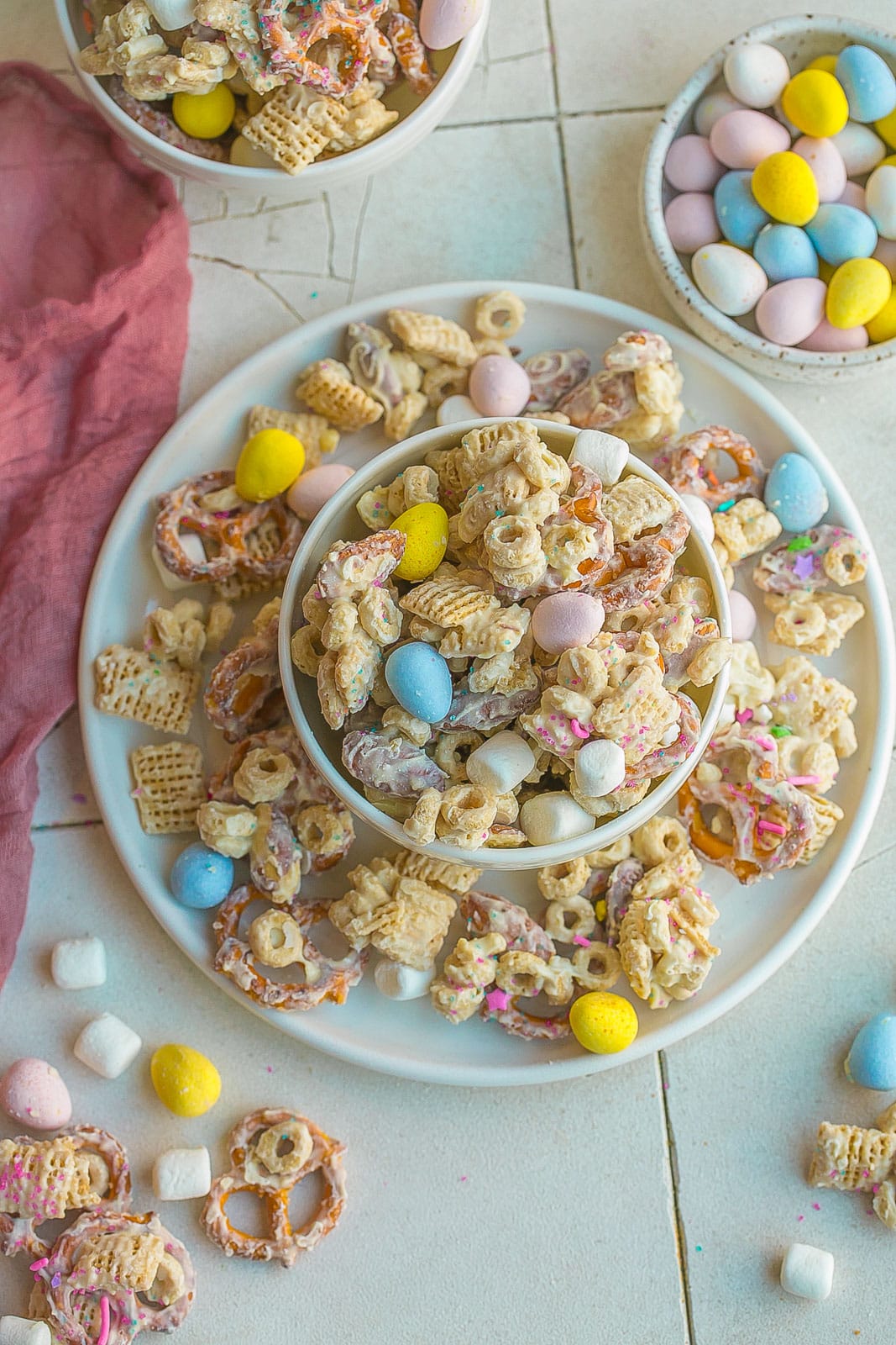 Bunny Bait (Easter Snack Mix) on a white plate. 