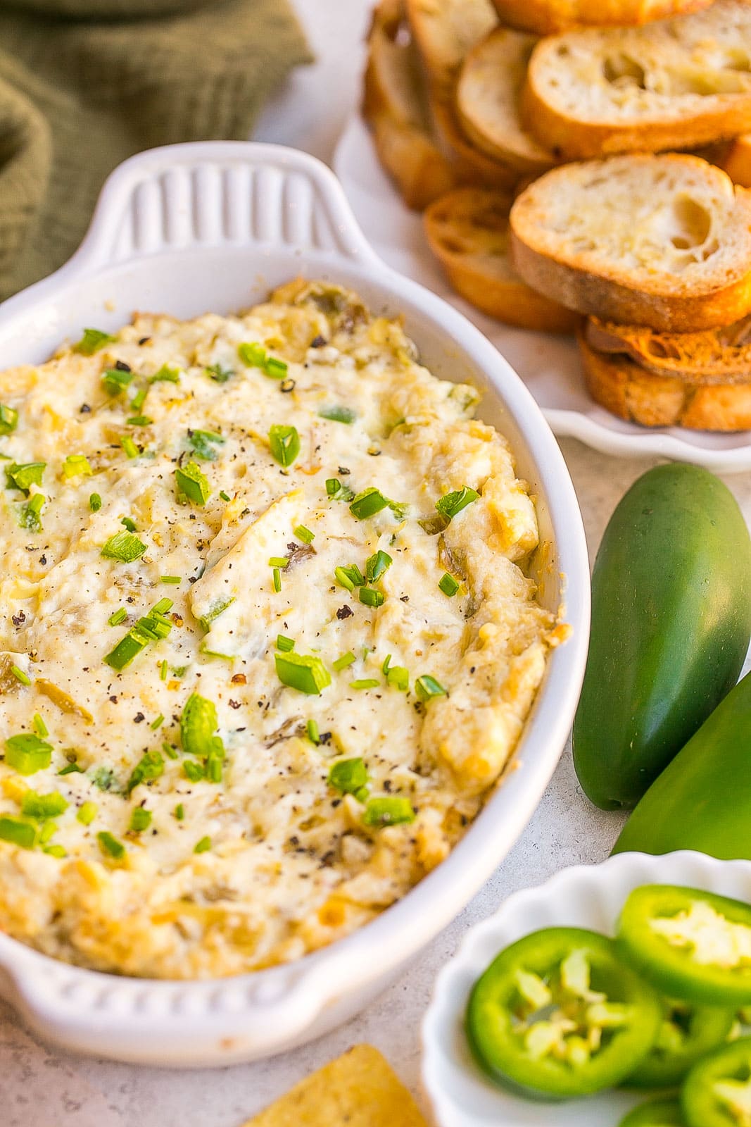 Side photo of Jalapeño Artichoke Dip with dippers.