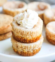 stack of snickerdoodle cheesecake bites with whipped cream
