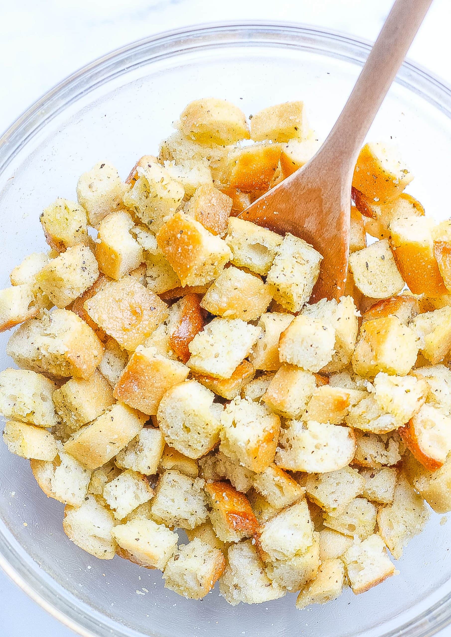 bowl of croutons with oil, butter, and seasoning