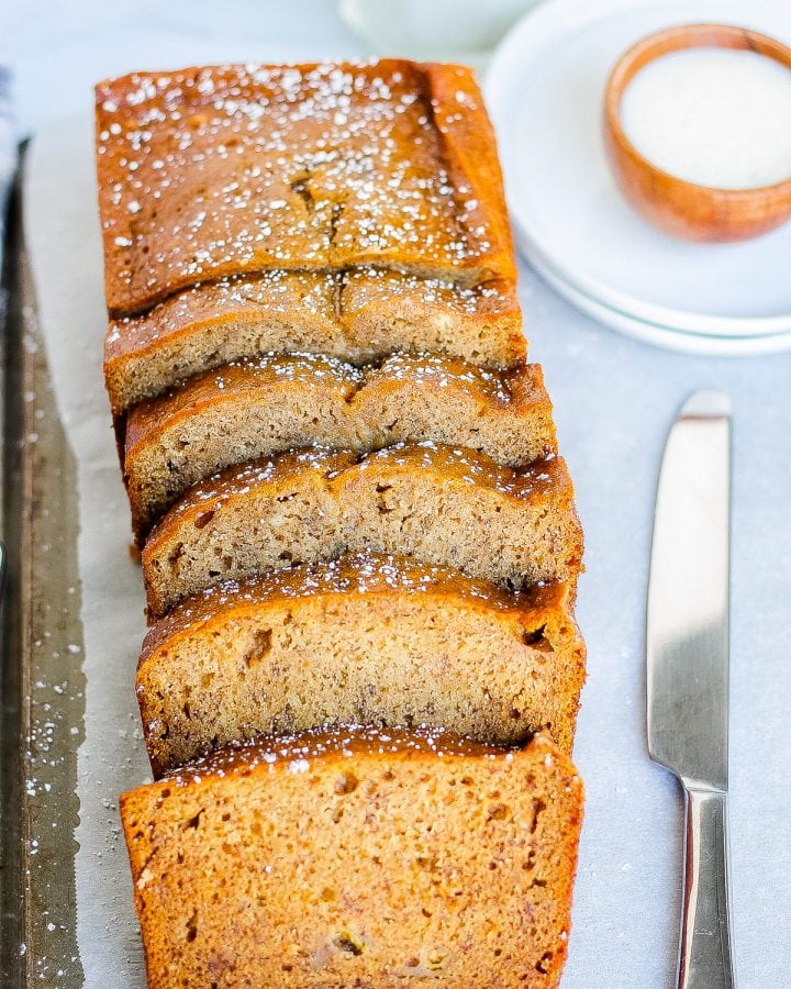 sliced banana bread with cinnamon and sugar with butter knife