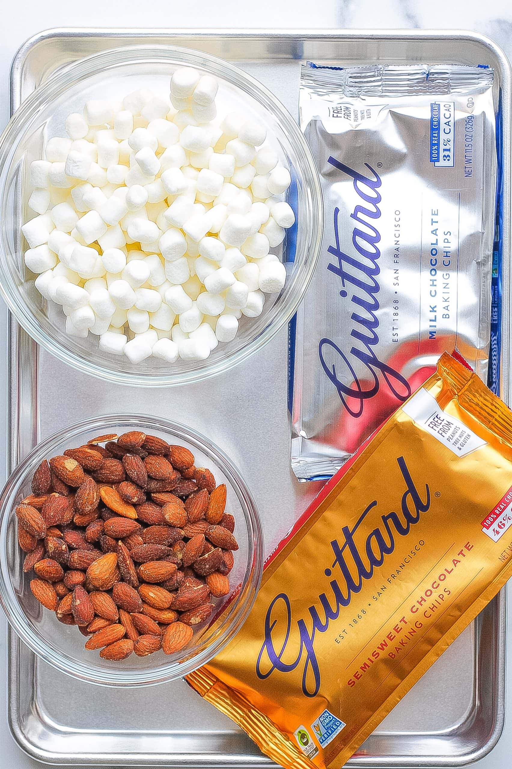 marshmallows, almonds, and chocolate chips on metal tray