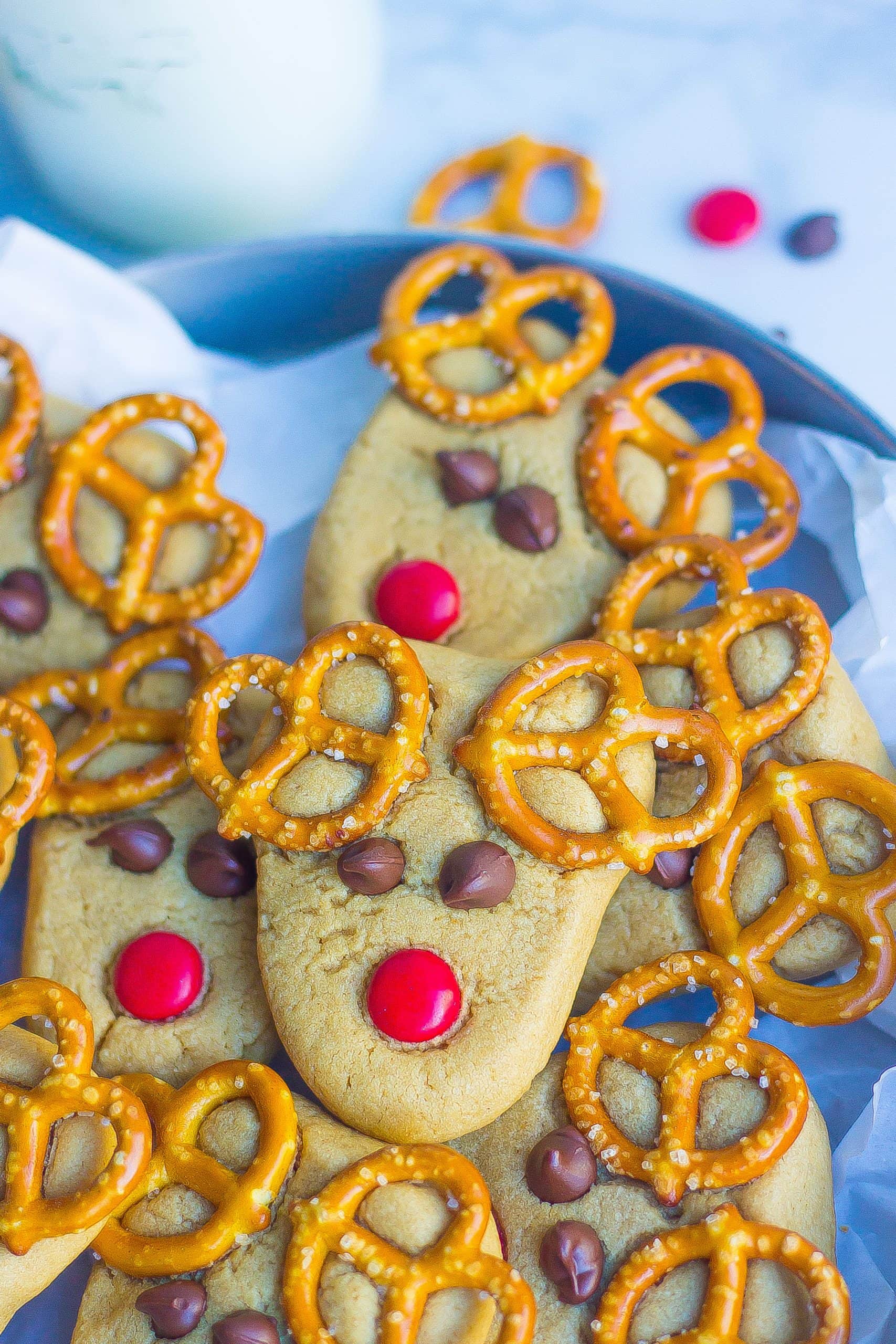 reindeer cookies layered on blue serving dish