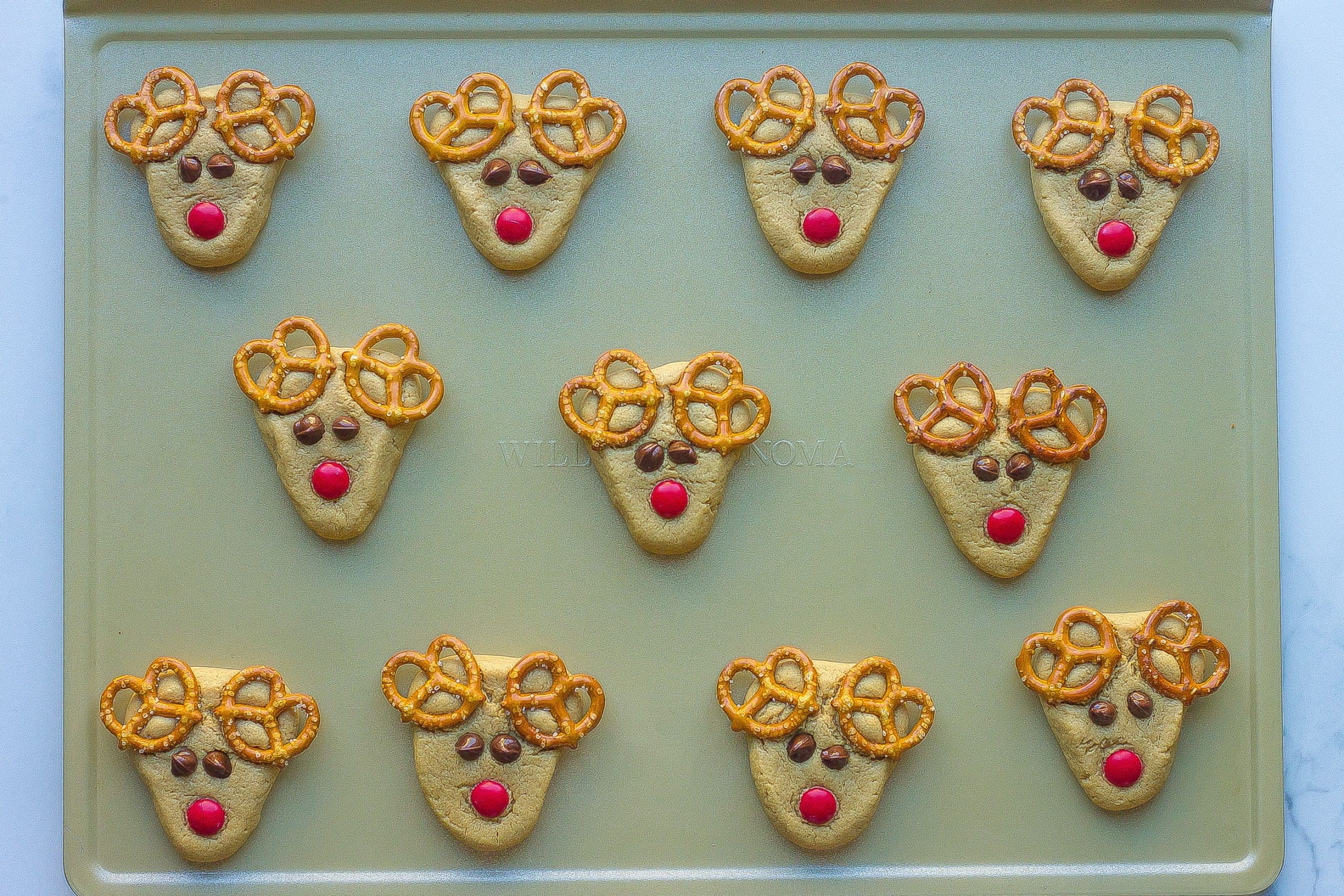 reindeer cookies on cookie sheet