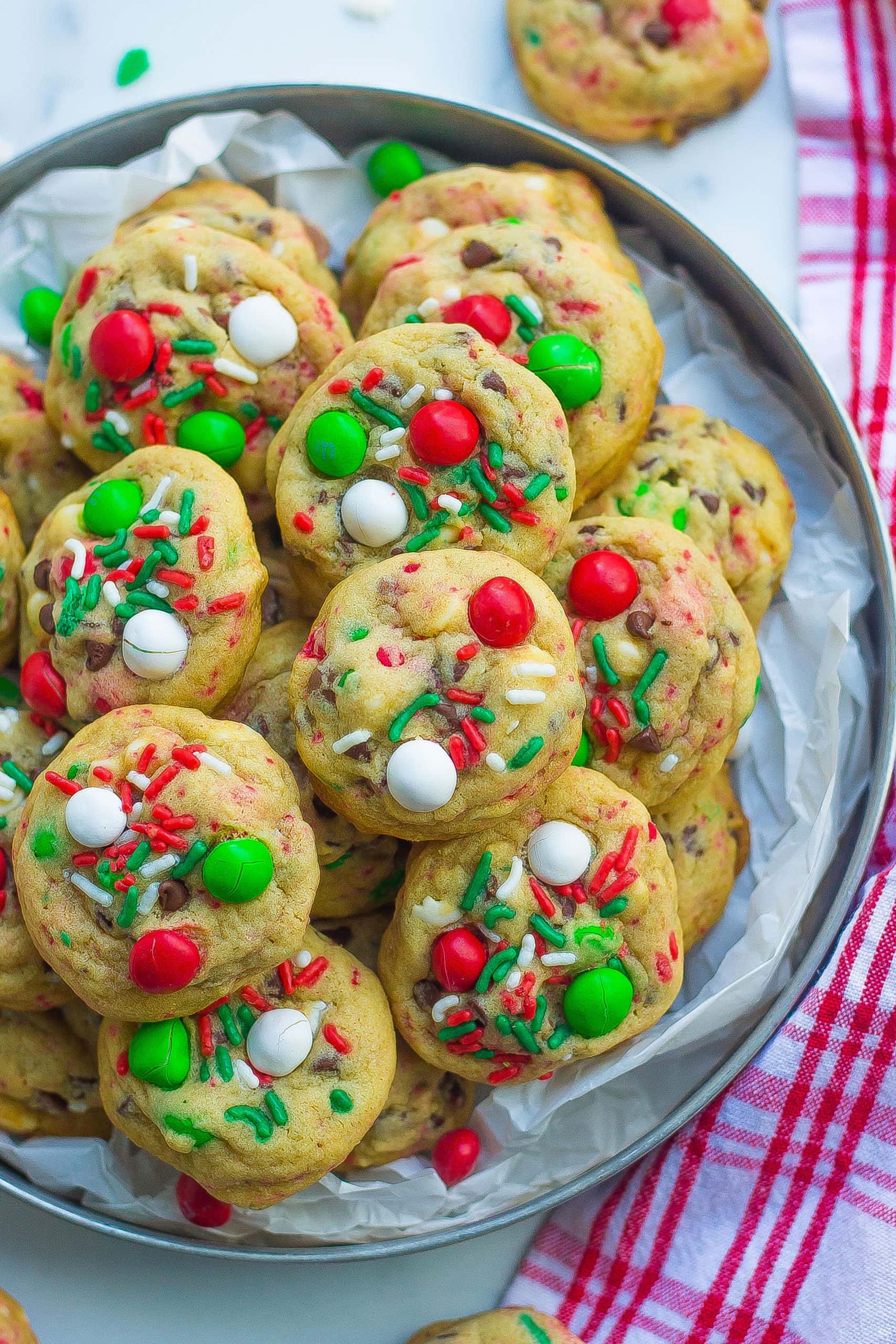 one tray of Santa cookies with sprinkles, M&Ms, and chocolate chips 
