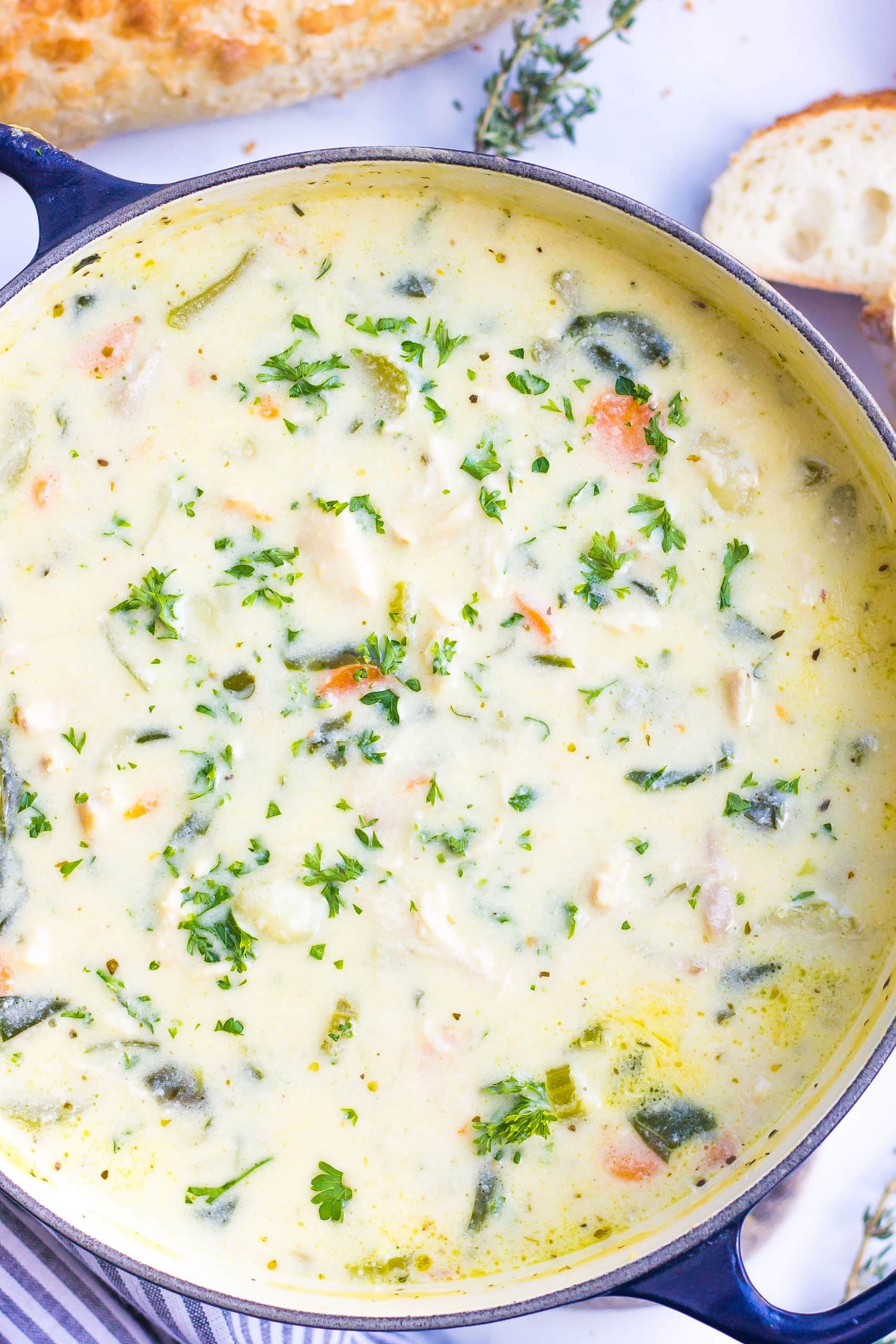 one pot of chicken gnocchi soup with spinach and herbs
