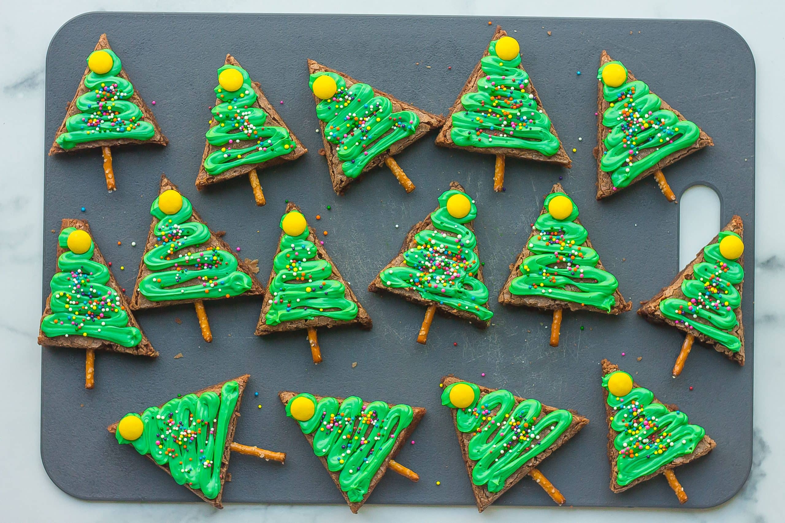 Christmas tree brownies on a cutting board