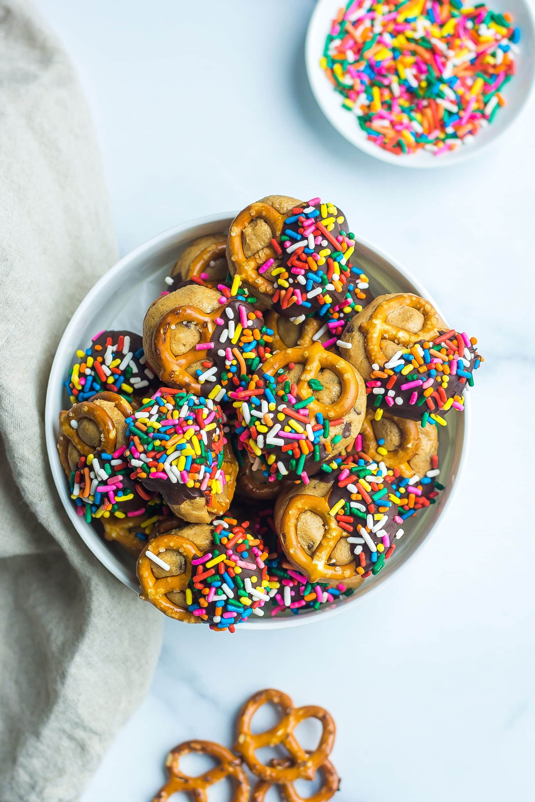 bowl of chocolate dipped pretzels with sprinkles