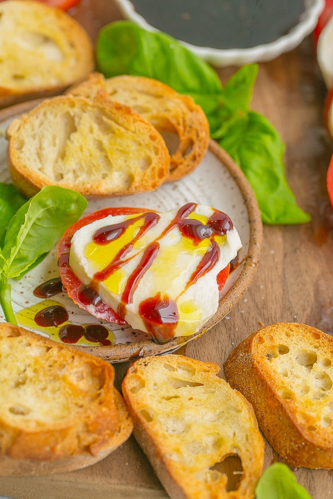 Crostini with caprese and. a vinegar glaze.