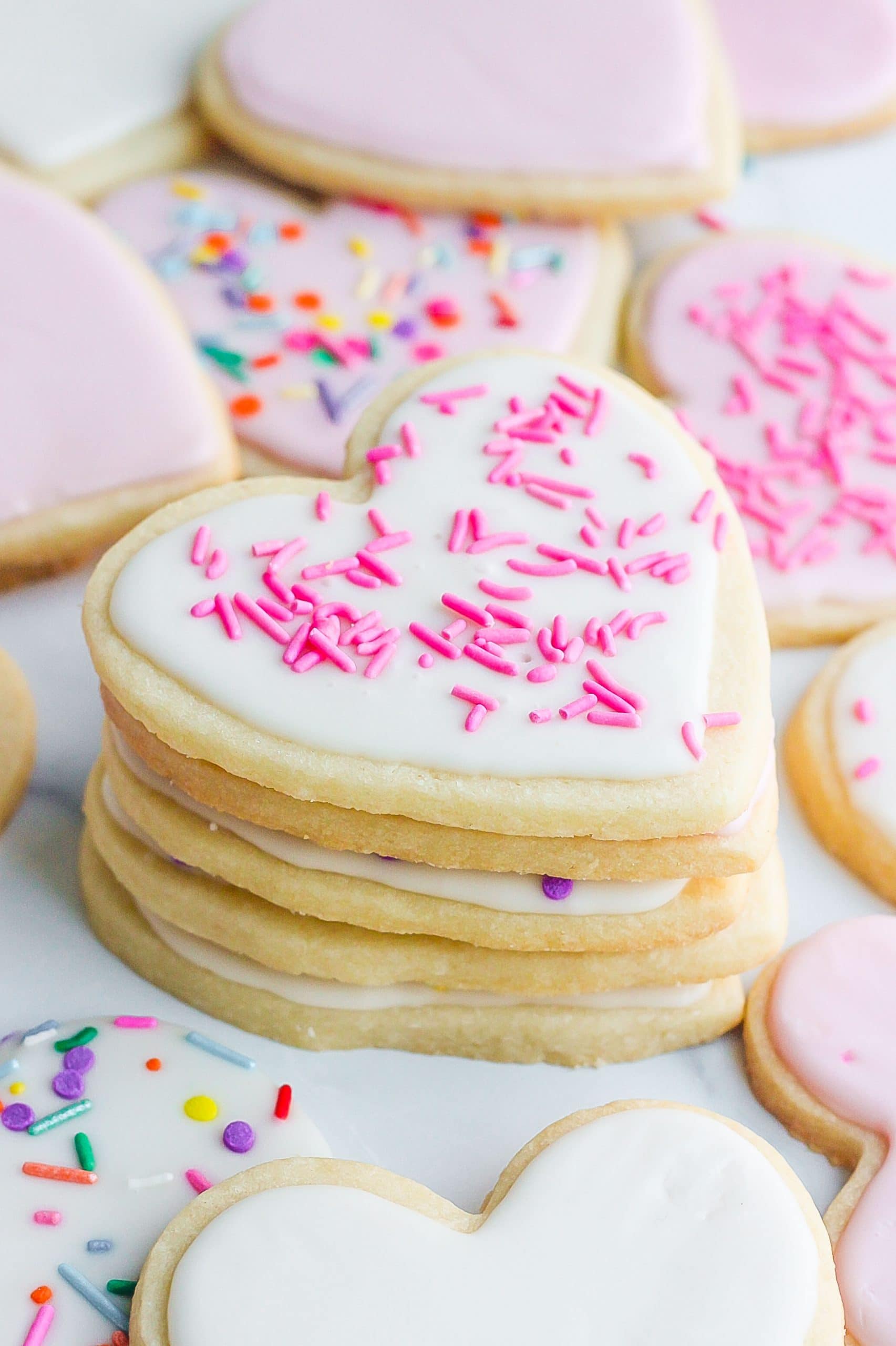 heart shaped sugar cookies with pink sprinkles