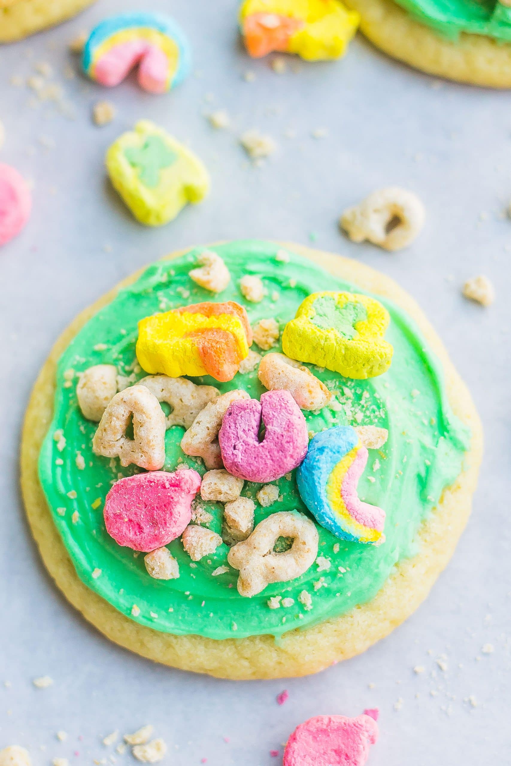close up of lucky charms on frosted cookie