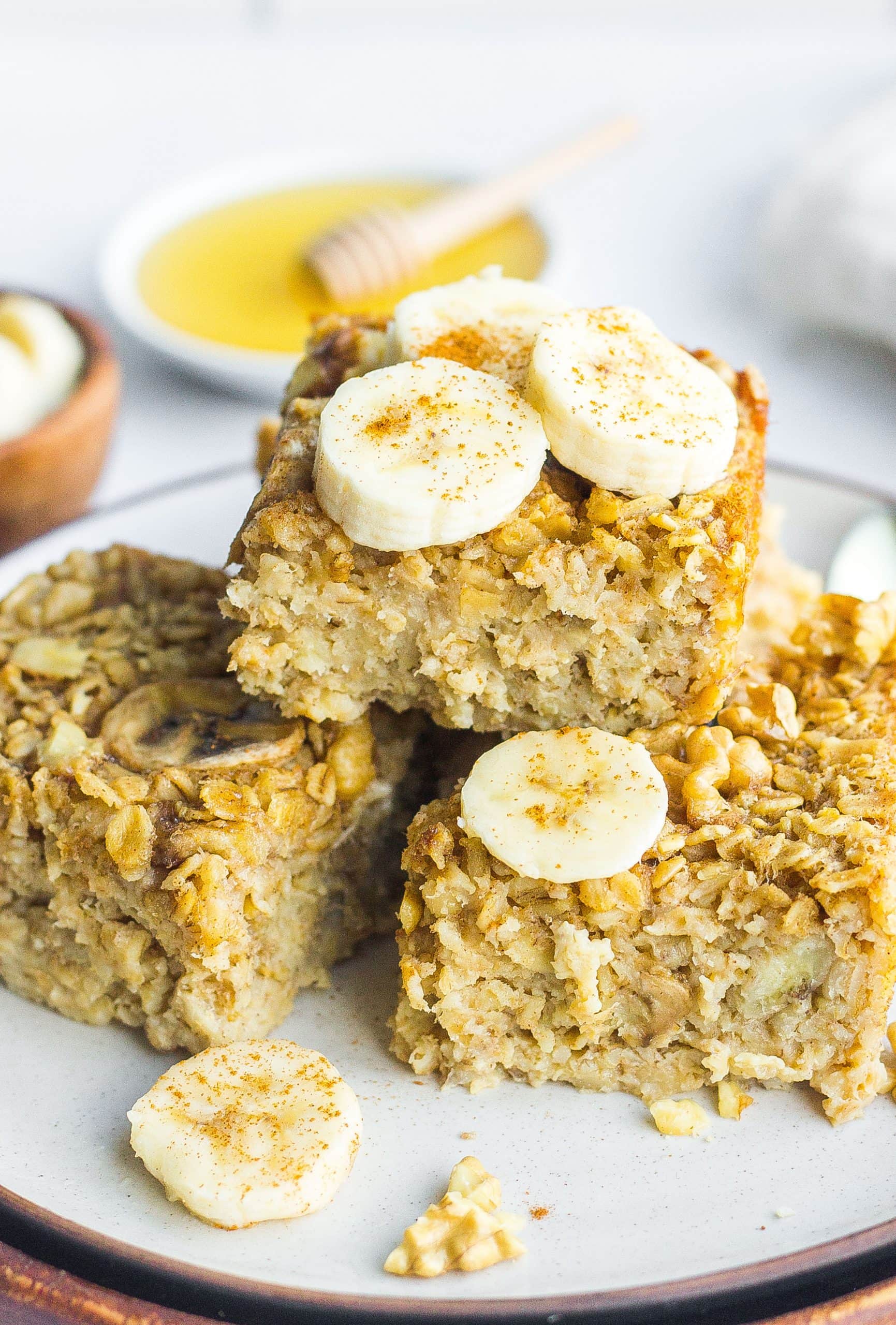 baked oatmeal on plate with sliced bananas