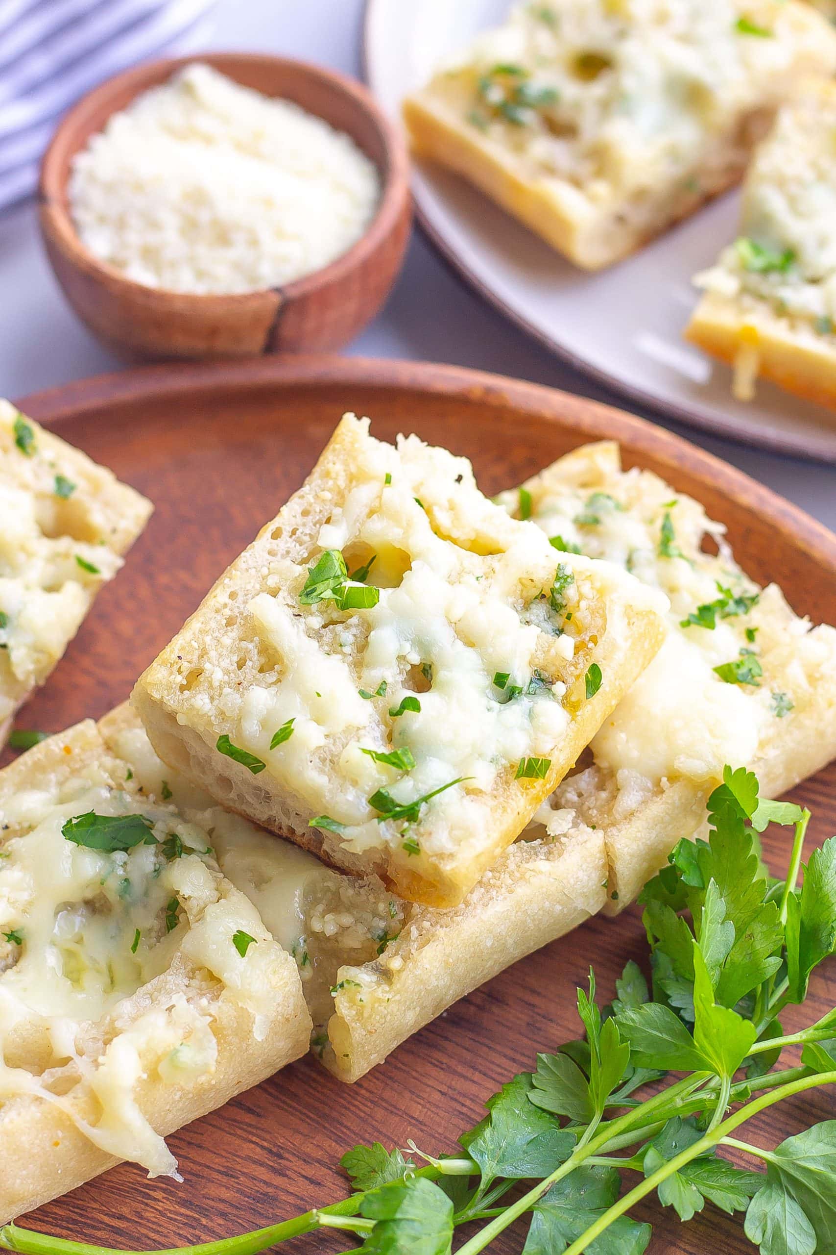 garlic bread on a plate with cheese