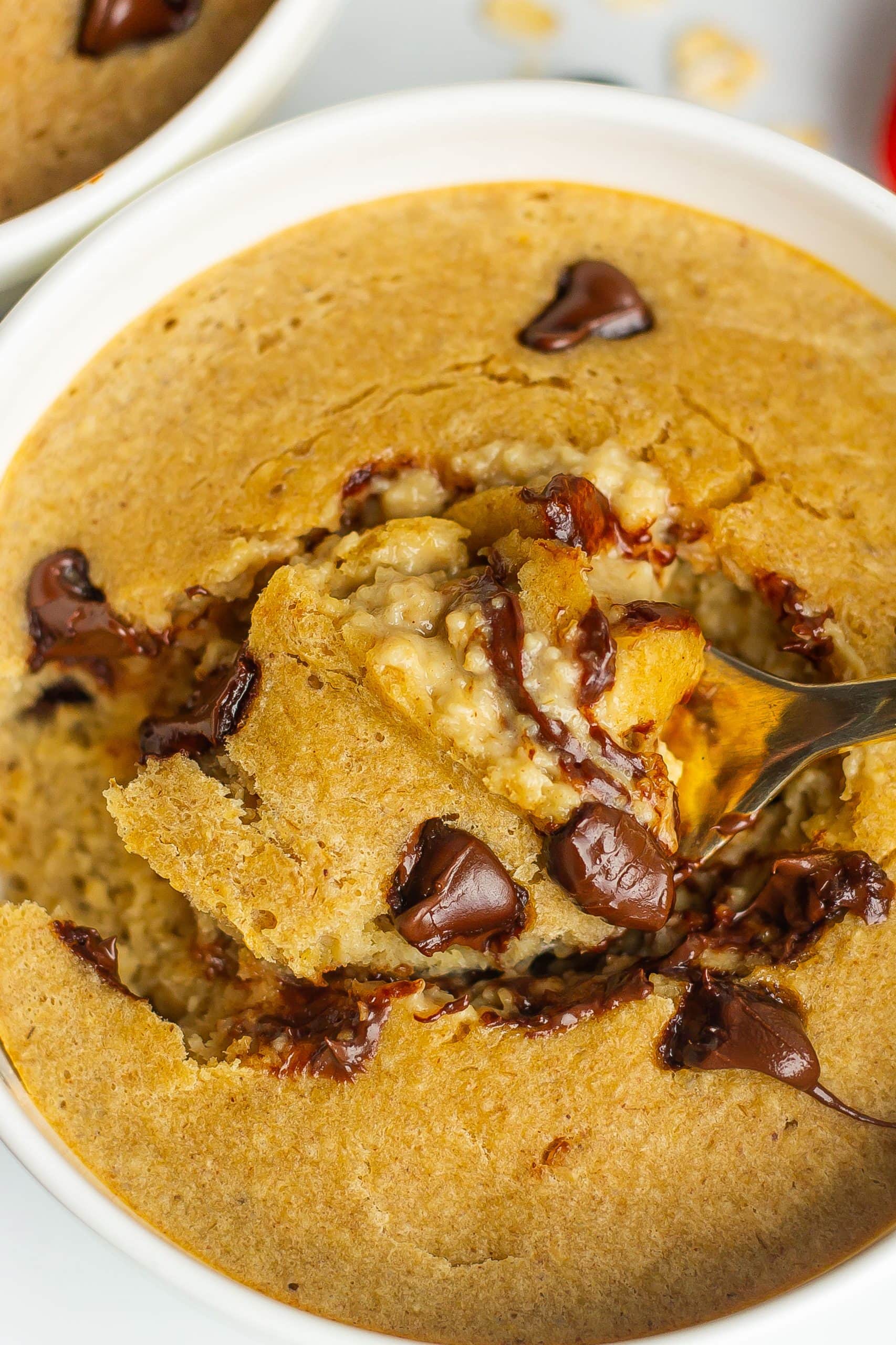 baked oats recipe out of the oven with a gold spoon