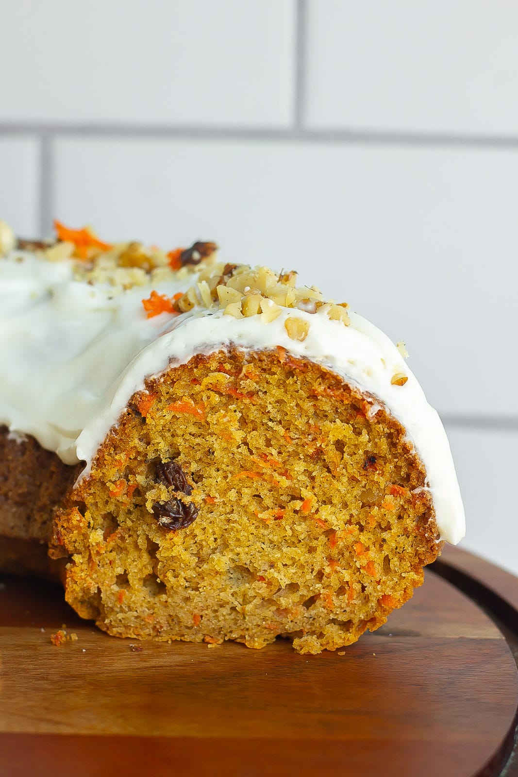 carrot cake with cream cheese frosting on cake platter