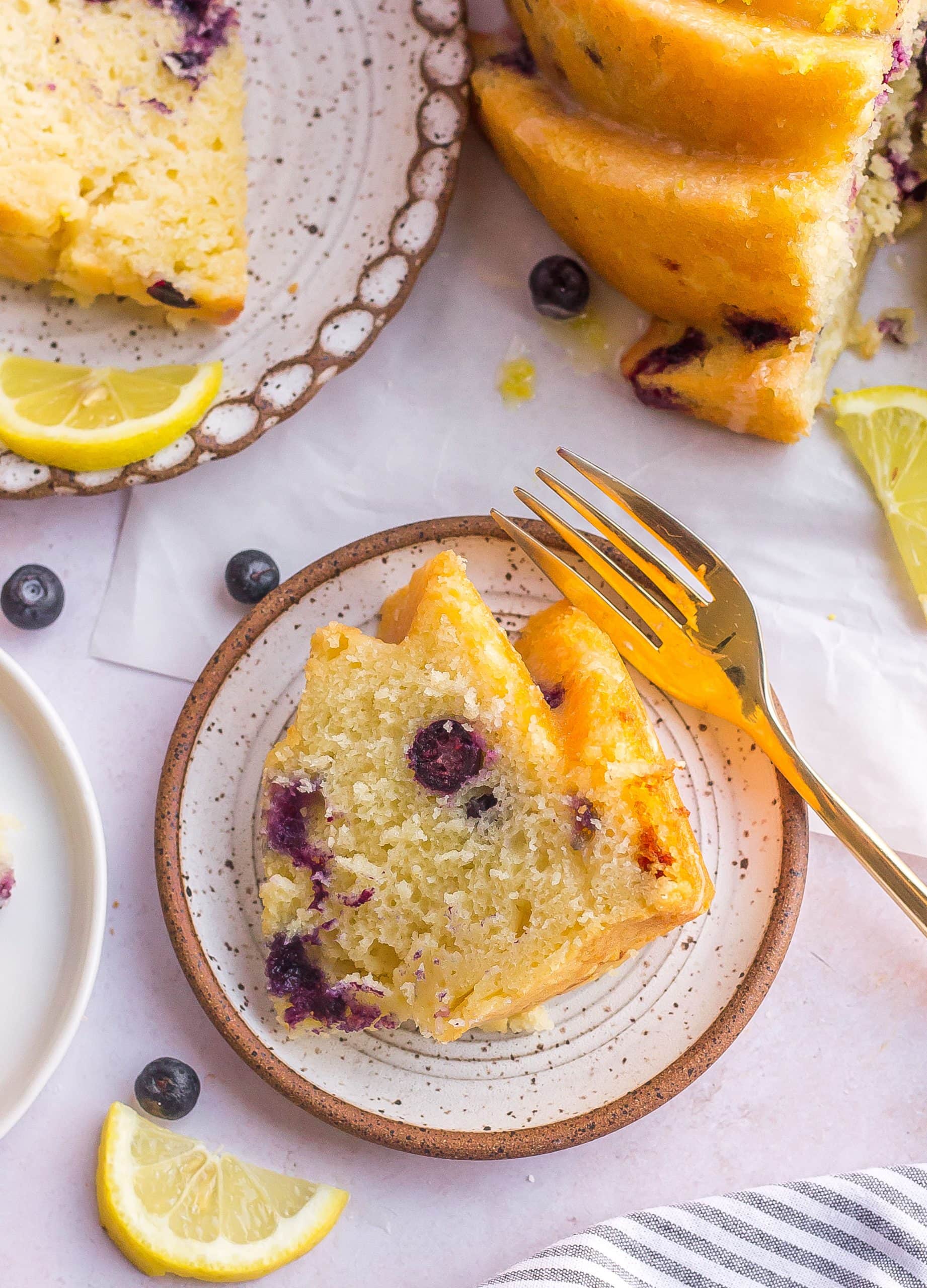 lemon blueberry bundt cake on dish with fork