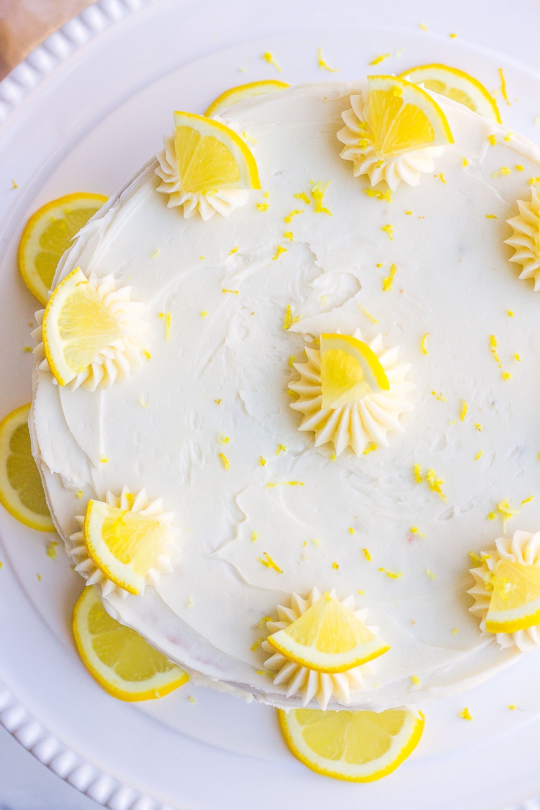 frosted lemon cake on cake stand- birds eye view
