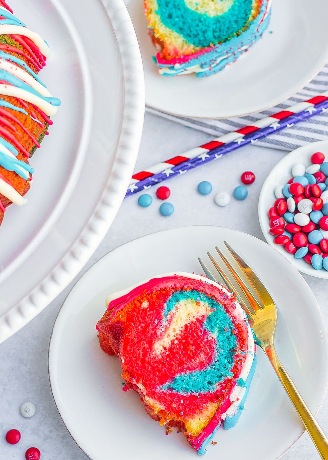 red, white, and blue bundt cake slice with fork