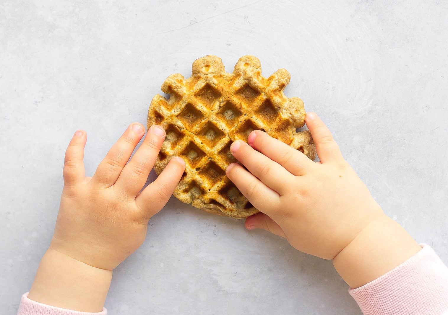kids hands on waffle