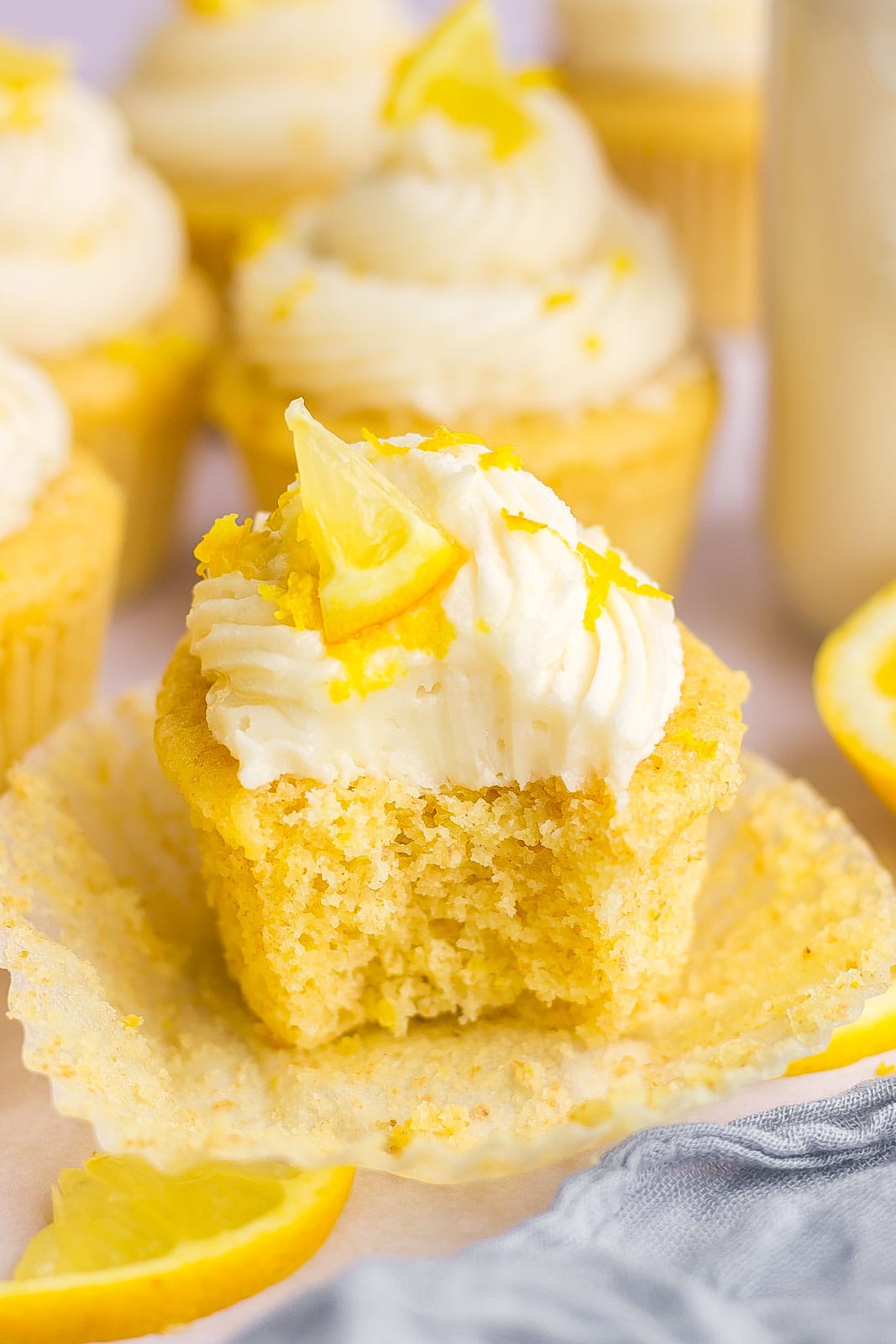 bite of lemon cupcake with frosting