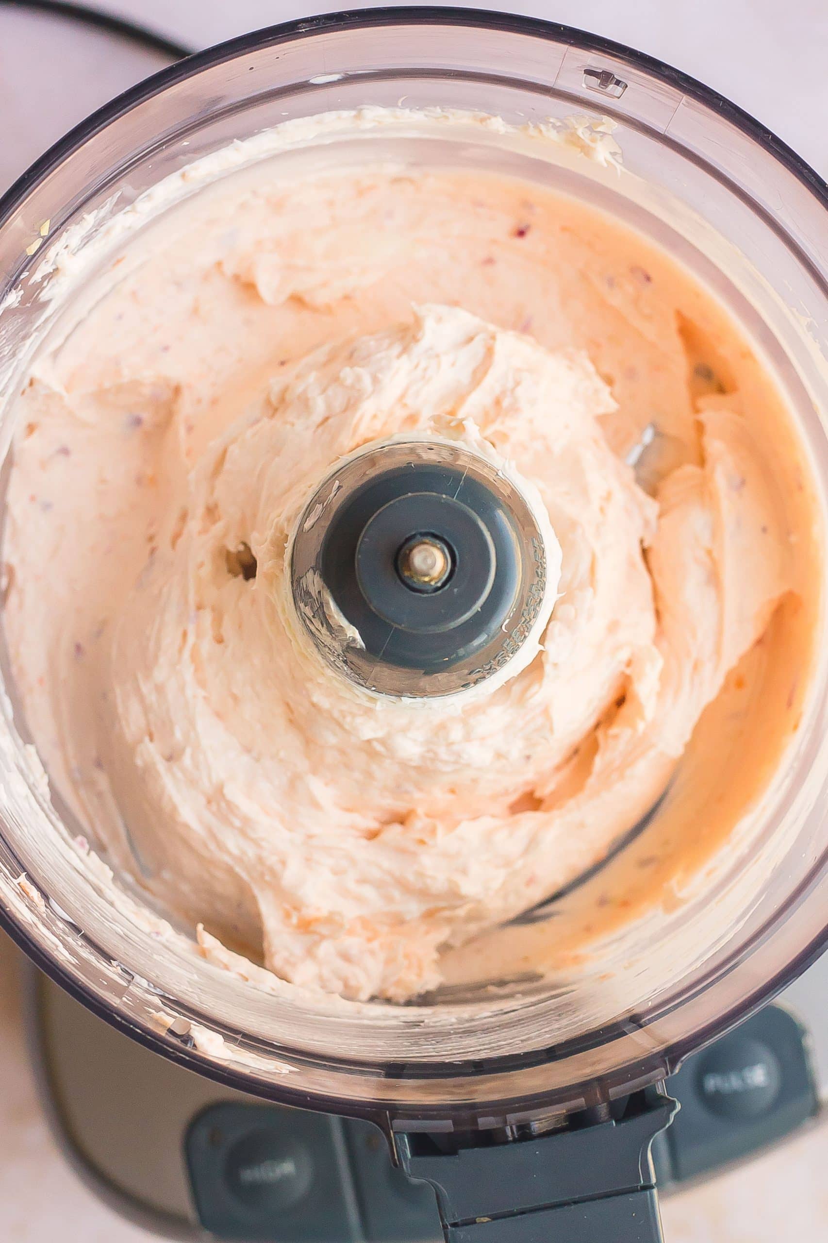 cream cheese in a food processor with smoked salmon