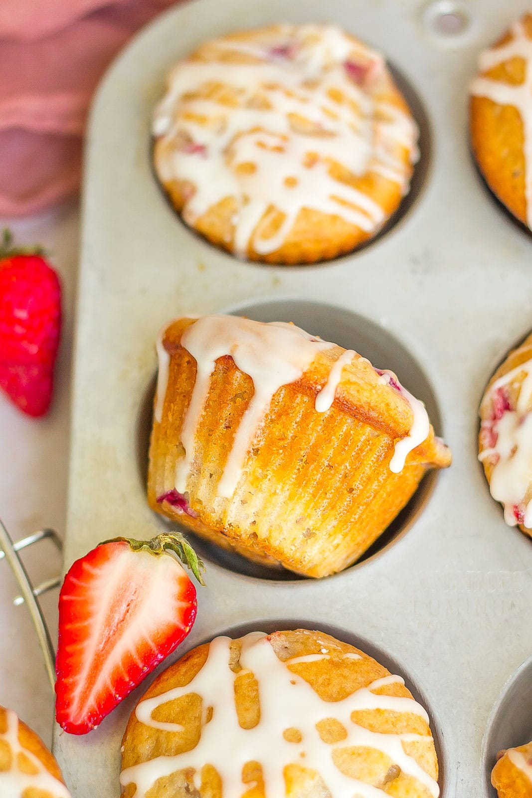 side view of a glazed strawberry glazed muffin