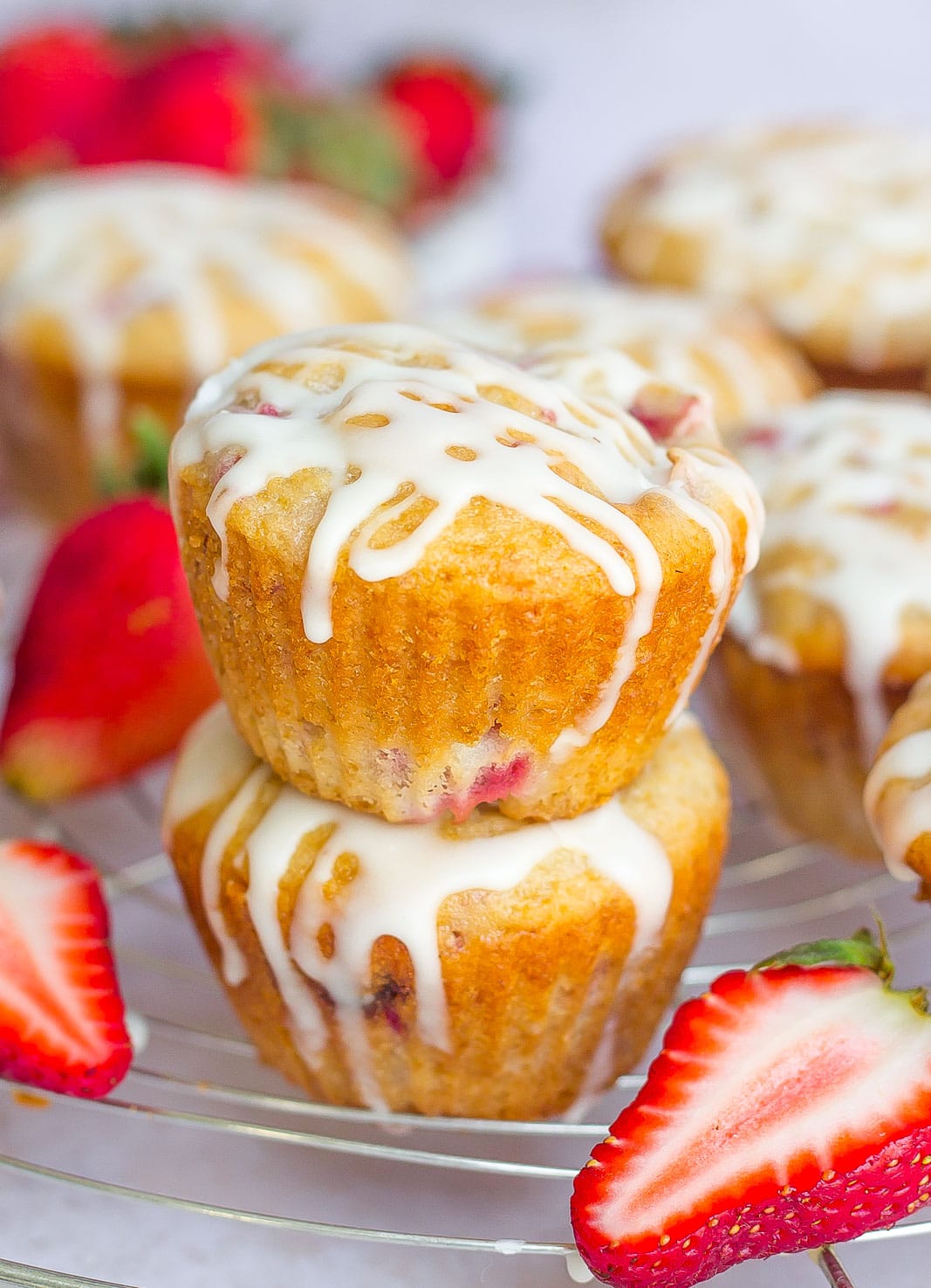Strawberry Yogurt Muffins on cooling rack with glaze