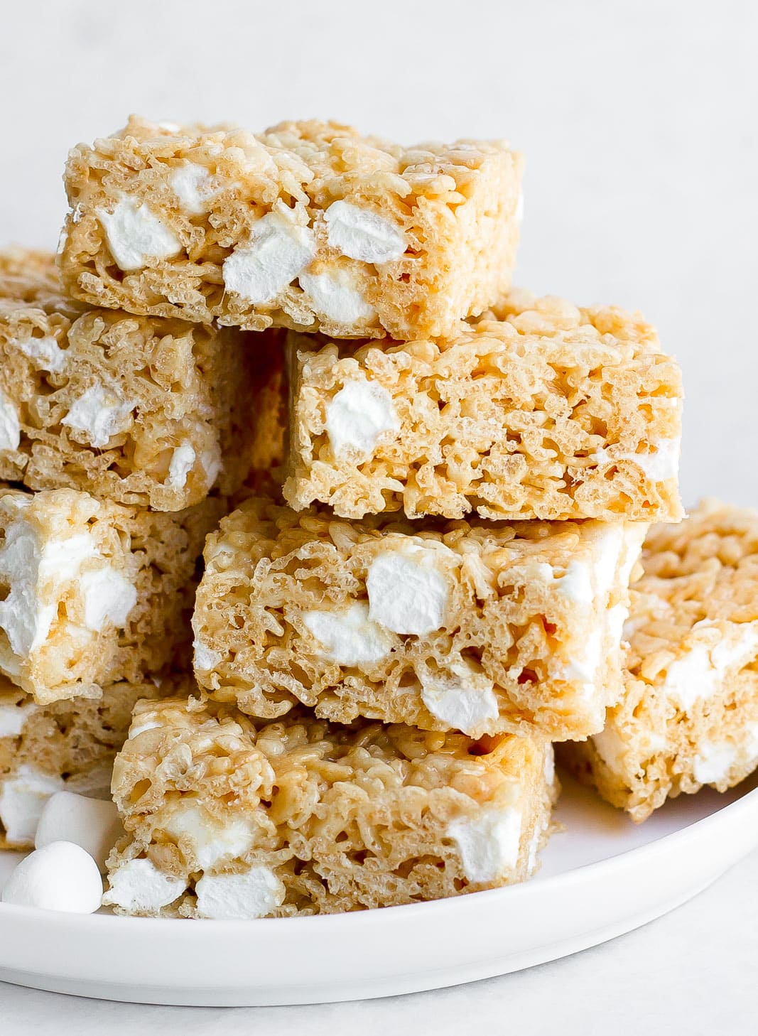 brown butter rice krispie treats on a white plate