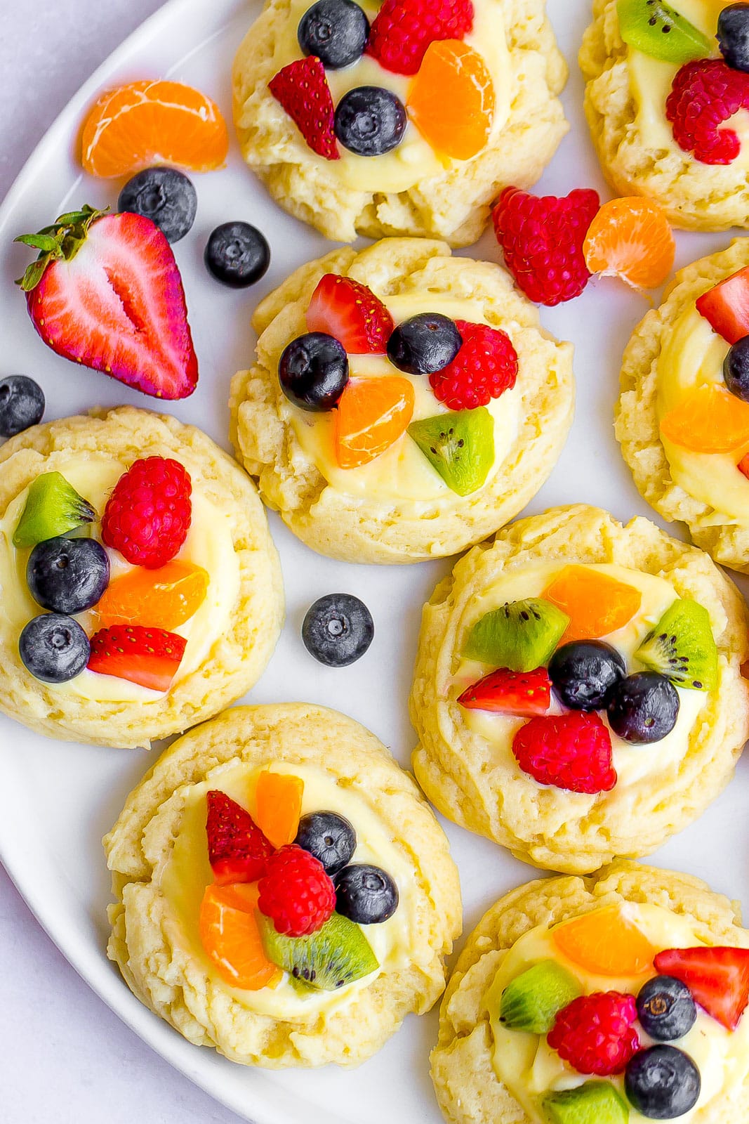 fruit pizza cookies on a white plate