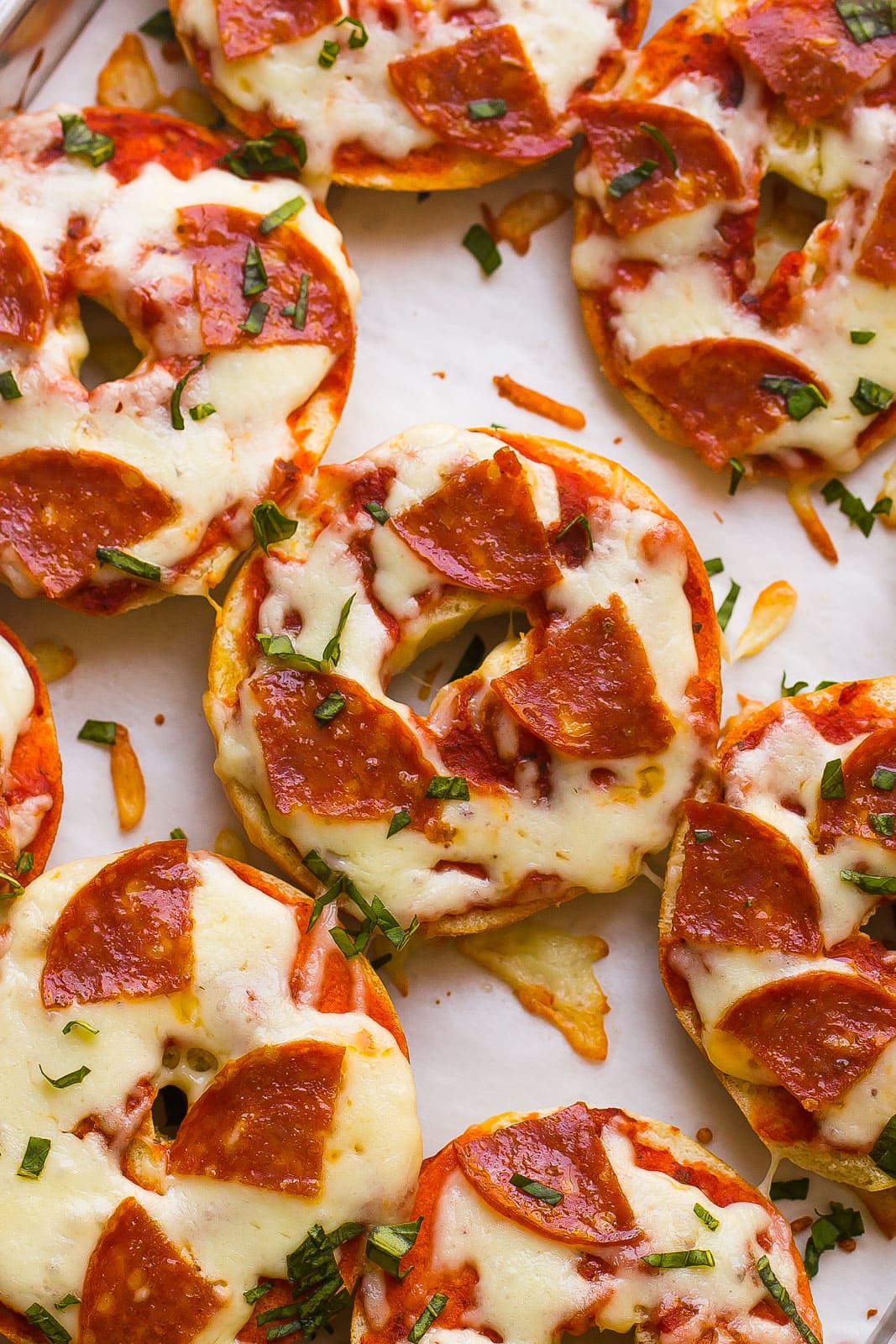 pizza bagels with melted cheese and pepperoni 