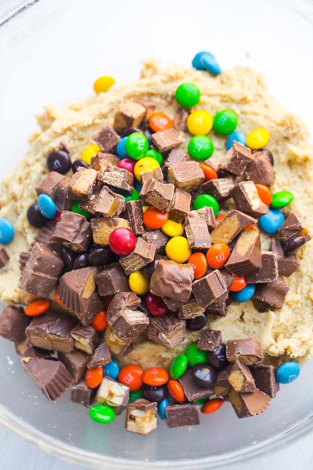Bowl of cookie dough with candy pieces. 
