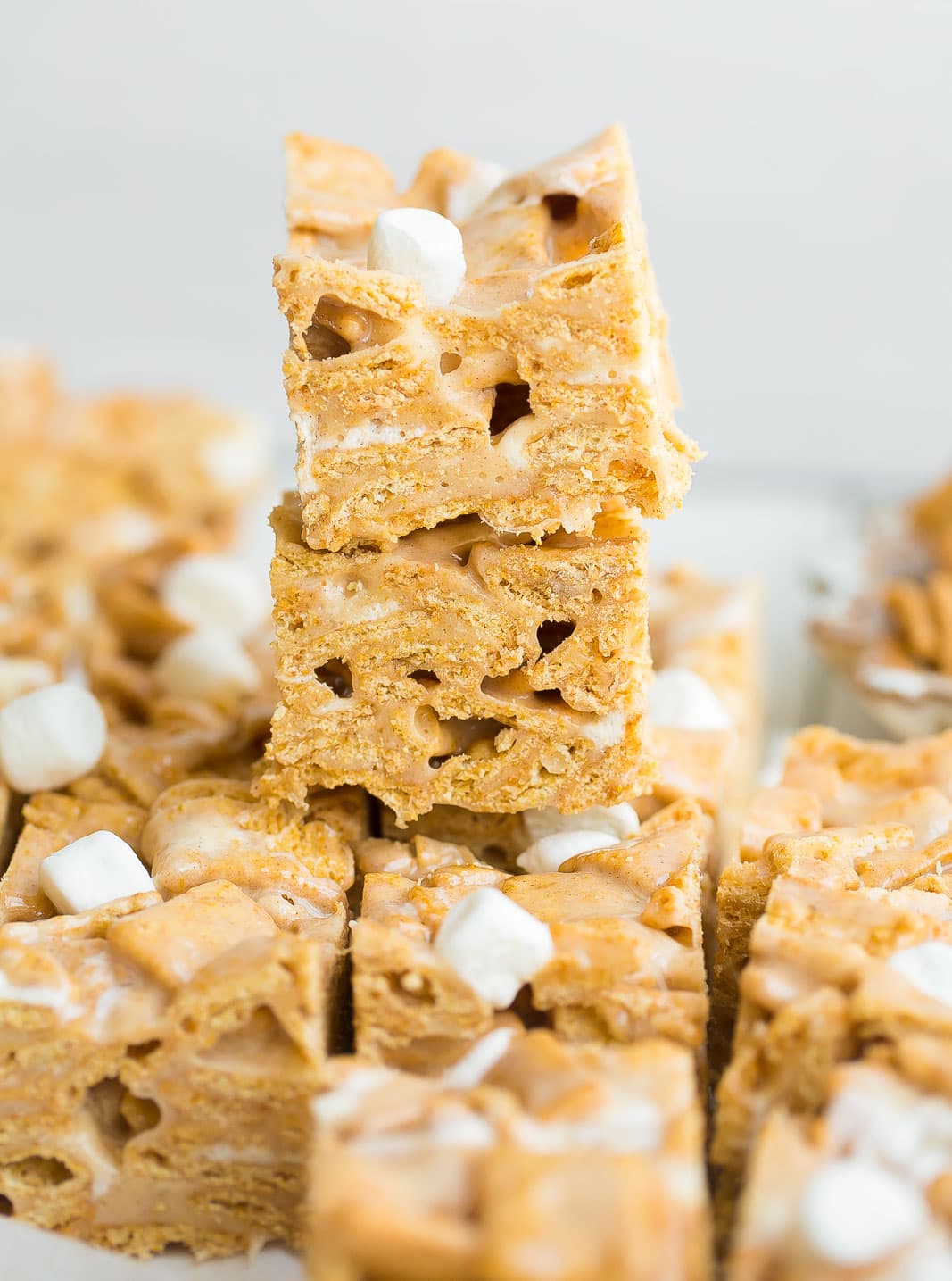 Cinnamon Toast Crunch Cereal Bars stacked on top of each-other.
