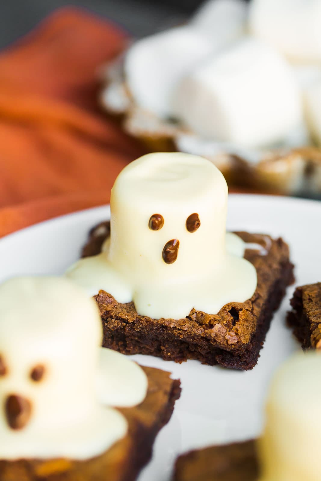 Halloween Ghost Brownies on a white plate.
