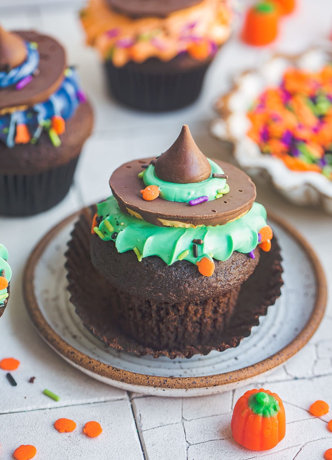 Unwrapped Halloween Witch Hat Cupcake on small dish.