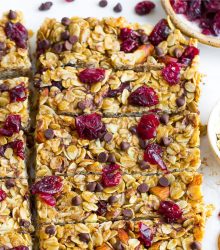 chewy granola bars with dried cranberries on a plate